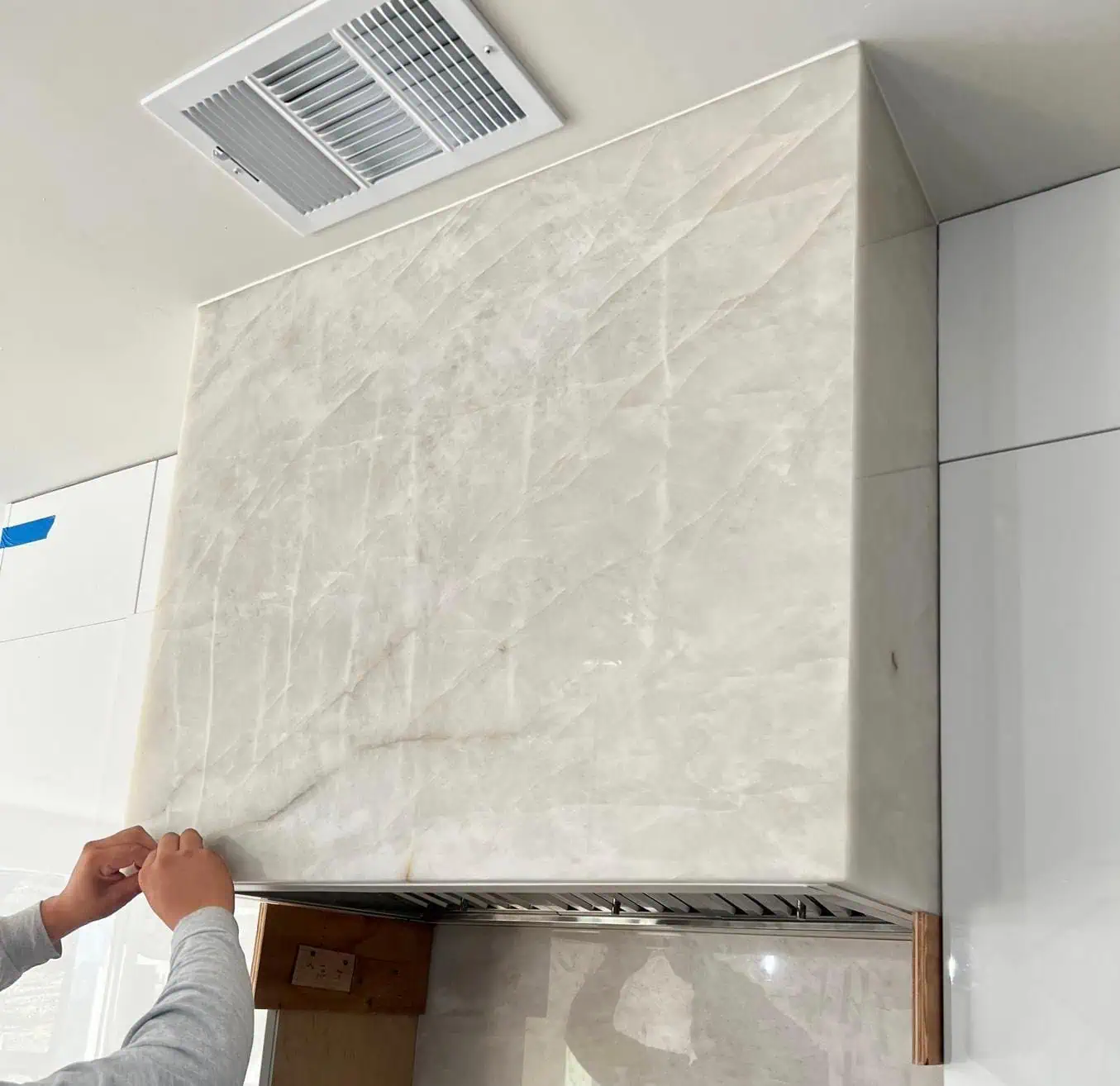 White marble kitchen countertop with subtle veining and polished finish.